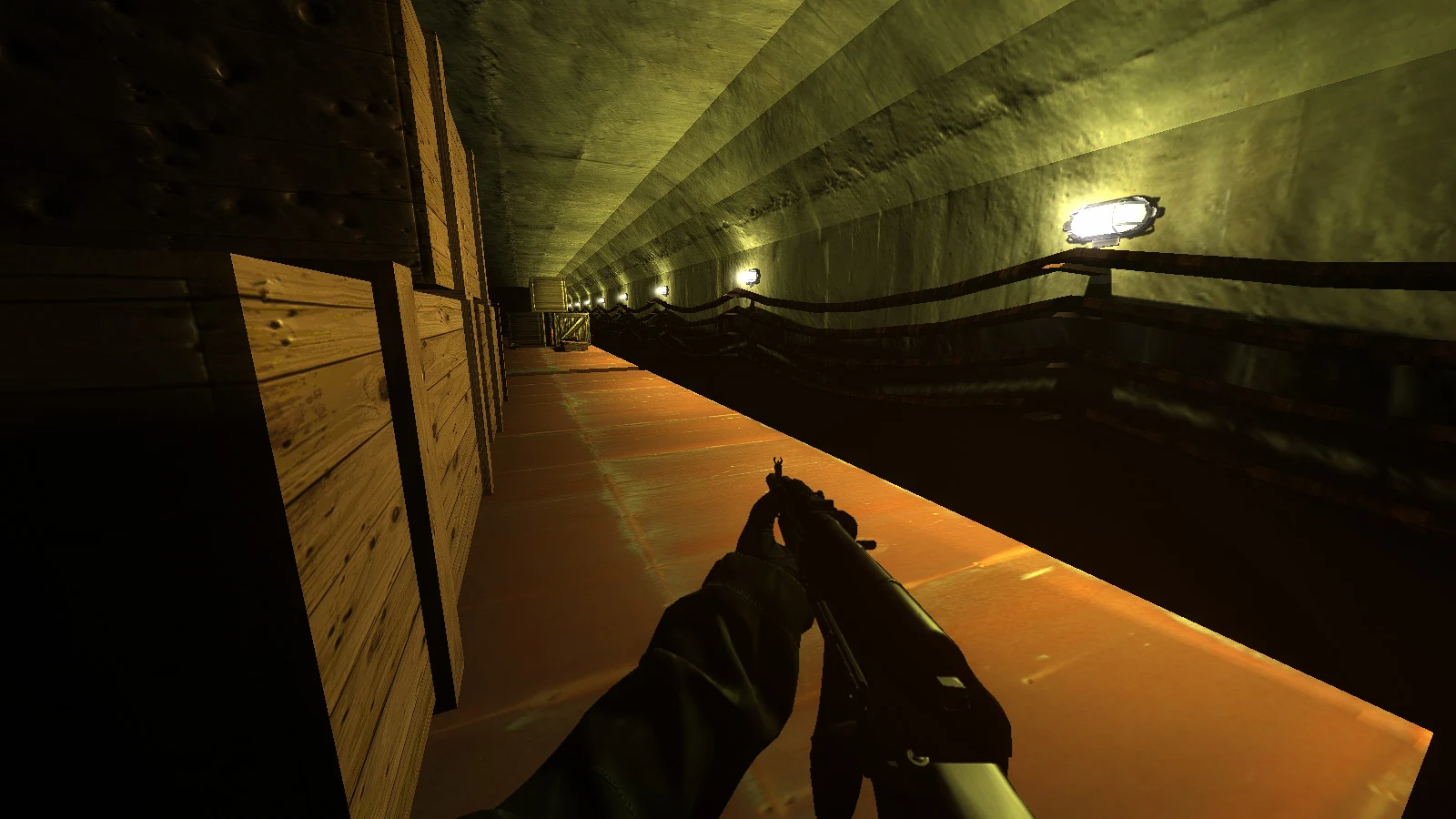 An illuminated underground passage lined with crates and utility cables in Object N